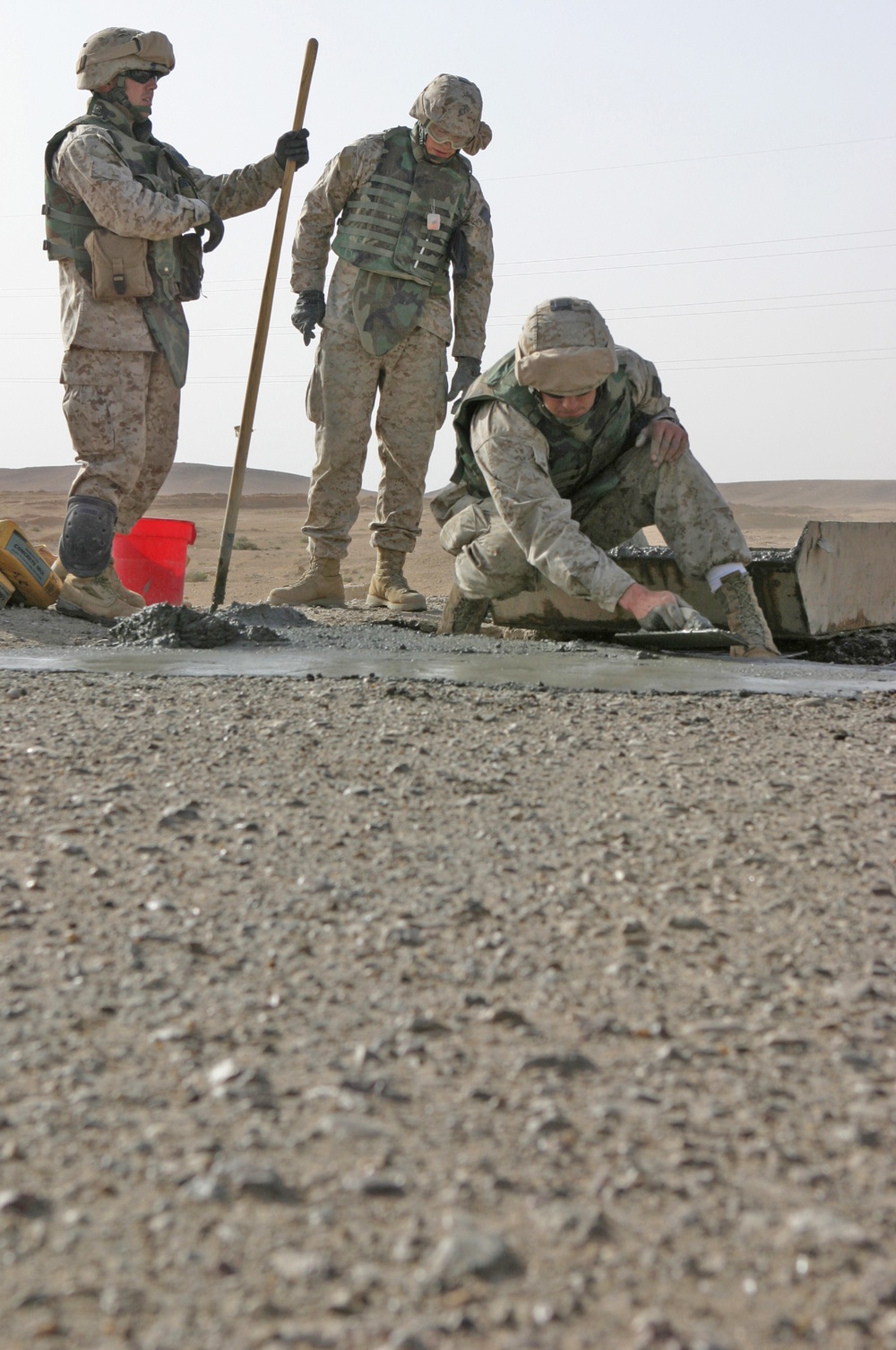 Marines smooth concrete poured into a crater