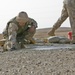 Lcpl. Patterson smoothes concrete poured into a crater