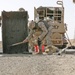 Marines pour concrete into a crater in Western Iraq