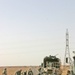 Marines repair a crater in a Western Iraqi road recently