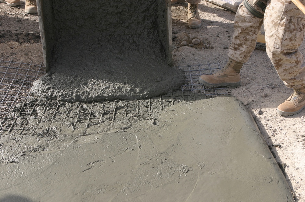 Marines pour concrete into a crater in Western Iraq recently