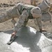 Lcpl. Patterson smoothes concrete poured into a crater