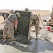 Marines pour concrete into a crater in Western Iraq recently