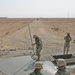 Marines inspect their work on a crater they repaired