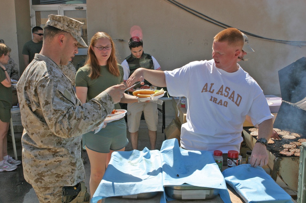 Petty Officer 3rd Class T. Scott Garmon serves food