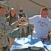 Petty Officer 3rd Class T. Scott Garmon serves food