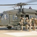 Sailors unload wounded Marines from an Army UH-60Q