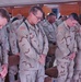 Soldiers say a silent prayer for their fallen friends
