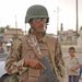 An Iraqi army soldier stands guard during a joint patrol
