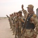 Iraqi army solidiers stand use hand and arm signals