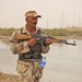 An Iraqi army soldier patrols through the streets