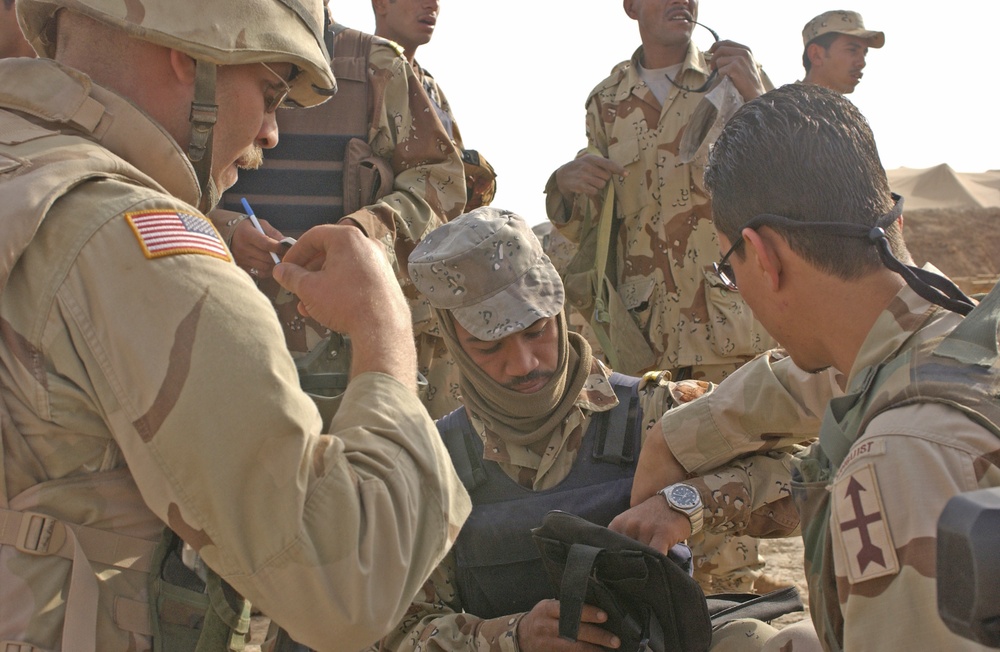 Spc. Scott Turk conducts a pre-mission inspection