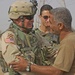 SFC Todd Kuchelmeister talks with a local Iraqi leader