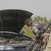 A Task Force 1-128 Soldier observes an Iraqi army soldier