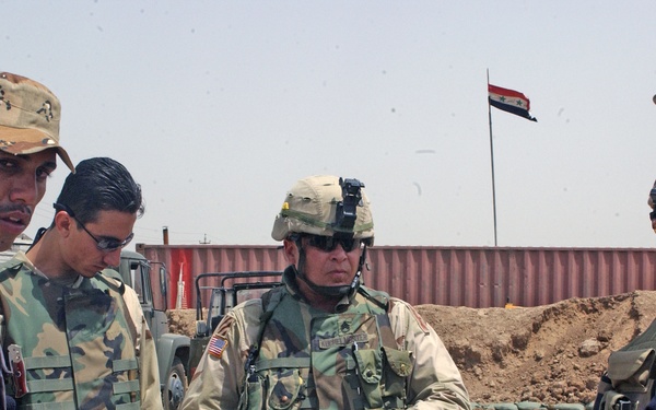 Sgt. 1st Class Todd Kuchelmeister conducts an after action revie