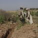 Capt. Paul Shannon inspect a trench with a city council member