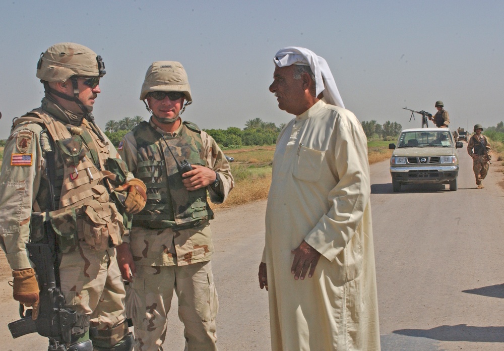 Capt. Paul Shannon talks to a city council member