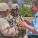 Capt. Paul Shannon talks to an Iraqi police officer