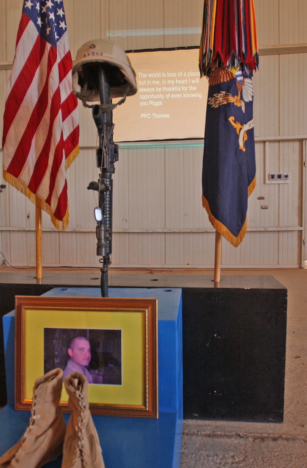 A slide show of Pfc. Wesley R. Riggs was played