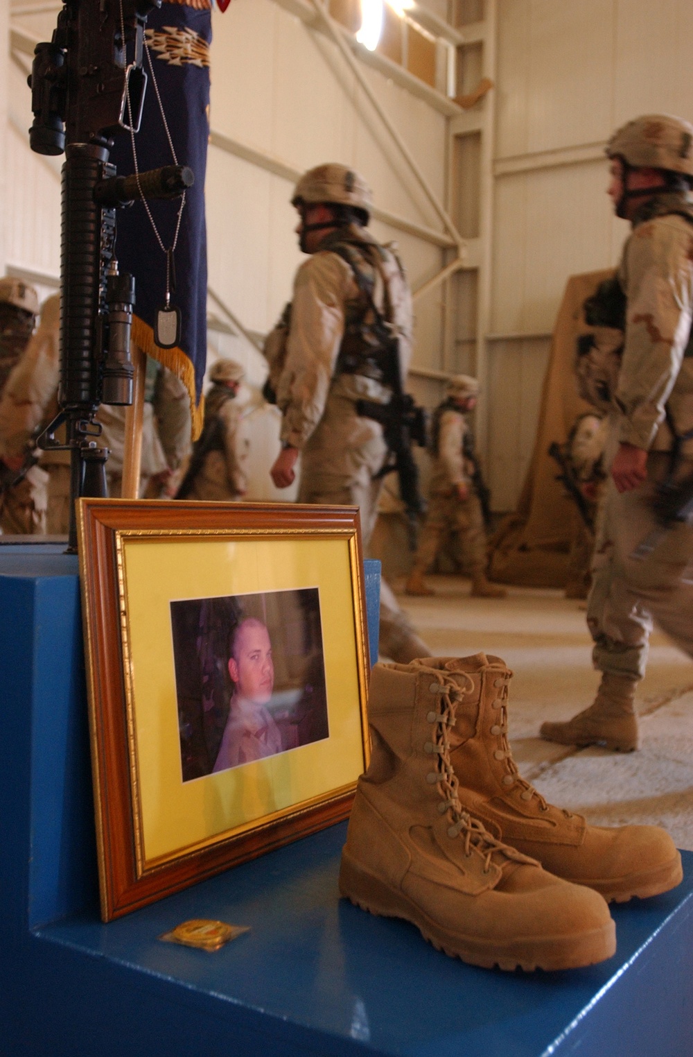 Soldiers file past the memorial of Pfc. Wesley R. Riggs