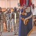 Soldiers render a final salute to a Pfc. Wesley R. Riggs