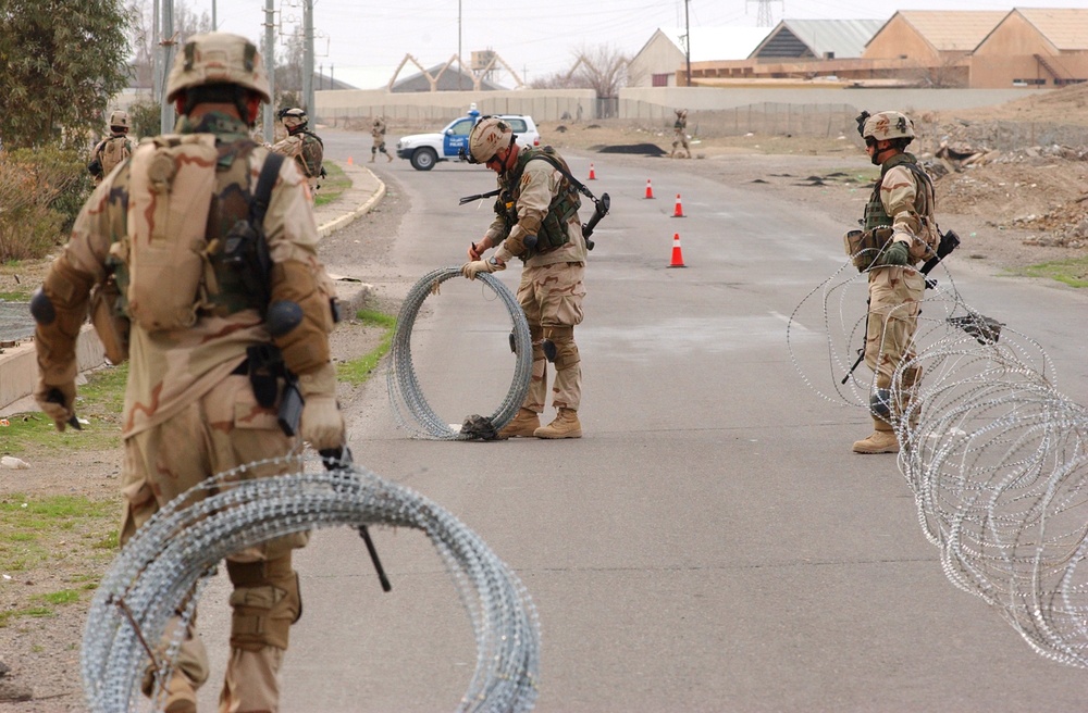 Soldiers set up a traffic control point in Tikrit