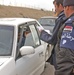 An Iraqi policeman checked the identification