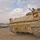 A gunner watches as an Iraqi civilian vehicle drives past A gunner watches as an Iraqi civilian vehicle drives past