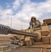 A Soldier stands guard in an M3A3 Bradley Fighting Vehicle