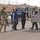 An Iraqi policeman checks the identification/registration An Iraqi policeman checks the identification/registration