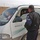 An Iraqi policeman checke the identification/registration An Iraqi policeman checke the identification/registration