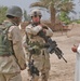 Sgt. 1st Class Brian Faltinson talks with an Iraqi man