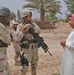 Sgt. 1st Class Brian Faltinson talks with an Iraqi man