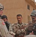 SFC Brian Faltinson talks with soldiers from the Iraqi army