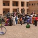 Iraqi children crowd around an Iraqi Army vehicle