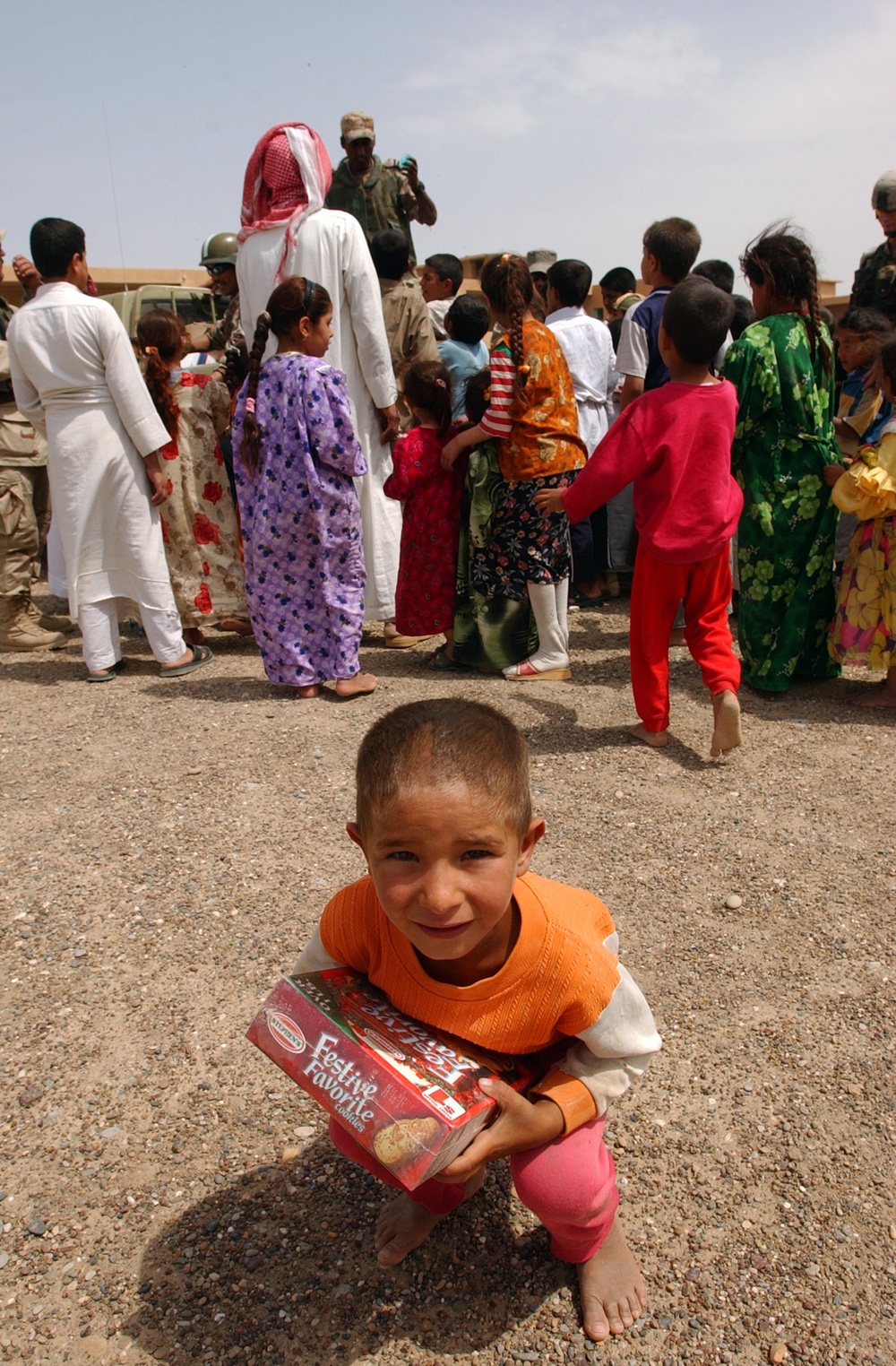 An Iraqi boy takes a moment to rest after getting cookies