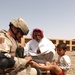 SSgt. Imperato dresses the wound of an Iraqi child