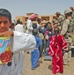 An Iraqi boy displays powdered drink mix