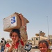 Iraqi children show their appreciation for the food/toys