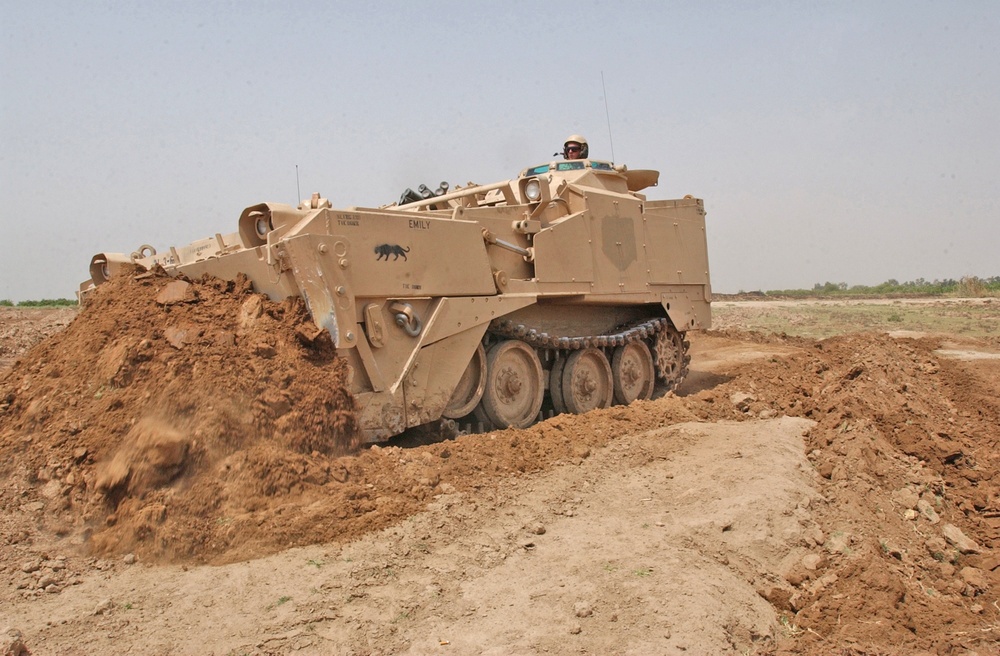 Spc. Morrissey uses an Armored Combat Earthmover