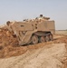 Spc. Morrissey uses an Armored Combat Earthmover