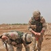 SSgt. Dennis Kradel pulls a 57mm round from a hole