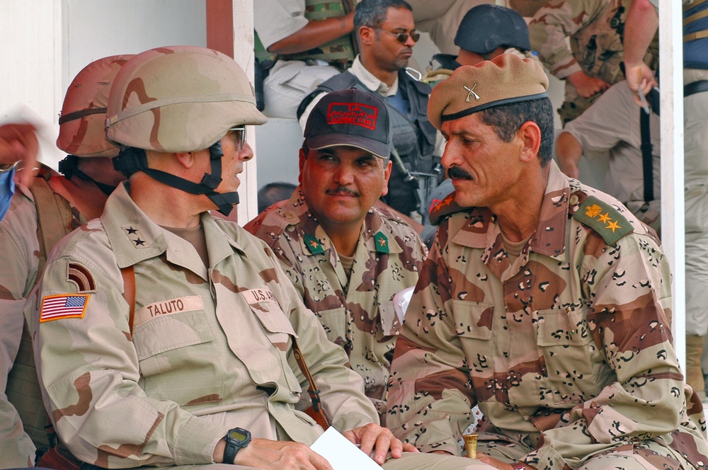 Maj. Gen. Taluto speaks with Iraqi Col. Faris Shaker