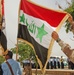 An Iraqi Police instructor checks the Iraqi Colors