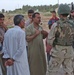 SSG Brian M. VanNote talks with Iraqis during a stop