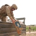 SFC Odoardi gently hands an eager boy a case of cookies