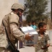 2nd Lt. Justin Otto is handed a box of bottled water