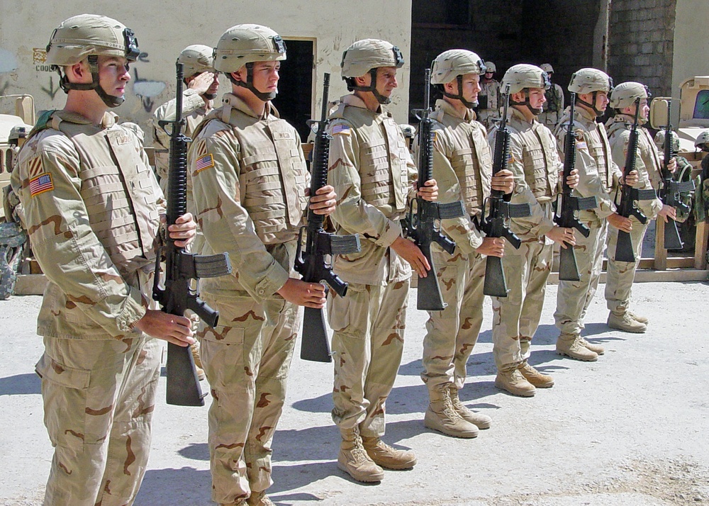 An Honor Guard renders a final salute