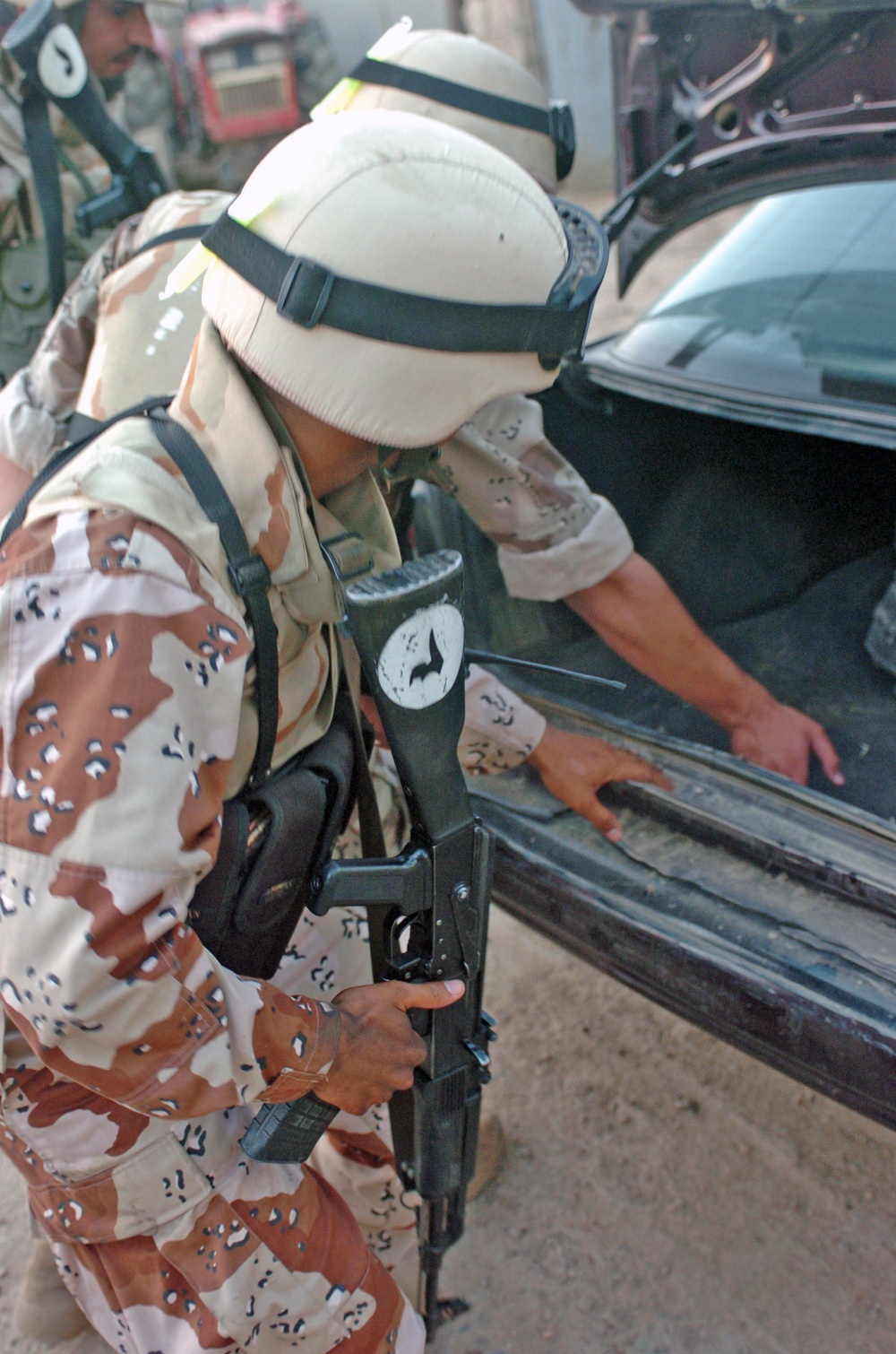 Iraqi Army searches a car during a cordon and search