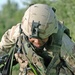 Sgt. Raymond Salgado jumps over an irrigation ditch